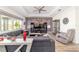 Well-lit living room features a coffered ceiling, large sectional, and stylish decor at 8820 Sw 104Th Cir, Ocala, FL 34481