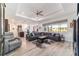 Bright and airy living room with a spacious sectional, wood floors, and a view of the outdoors at 8820 Sw 104Th Cir, Ocala, FL 34481