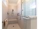 Walk-in shower featuring upgraded tile and built-in shelves at 8820 Sw 104Th Cir, Ocala, FL 34481