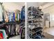 Spacious walk-in closet with ample storage, including racks for shoes and hanging clothes at 8820 Sw 104Th Cir, Ocala, FL 34481