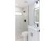 This bathroom includes a sink with black fixtures and sleek shower with marble tiling at 8878 Sw 133Rd Lane Rd, Ocala, FL 34473