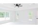 Bright bedroom with three windows, neutral walls, and a ceiling fan at 8878 Sw 133Rd Lane Rd, Ocala, FL 34473