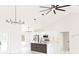 Bright kitchen boasts an island, stainless steel appliances, modern lighting, and white cabinets at 8878 Sw 133Rd Lane Rd, Ocala, FL 34473