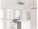 Open-concept space featuring a modern kitchen island with a sink, a dining area, and a living room area at 8878 Sw 133Rd Lane Rd, Ocala, FL 34473