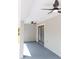 Covered porch with dual ceiling fans and access to the home via glass patio doors at 8878 Sw 133Rd Lane Rd, Ocala, FL 34473