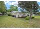 Expansive backyard with lush lawn, mature trees, and well-kept landscaping, offering privacy and serene views at 9015 Sw 94Th St # D, Ocala, FL 34481