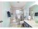A well-lit bathroom features a glass-enclosed shower, ample counter space, and a neutral color scheme at 9015 Sw 94Th St # D, Ocala, FL 34481