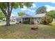 Well-maintained single-story home with lush green lawn, mature trees and fresh landscaping at 9015 Sw 94Th St # D, Ocala, FL 34481