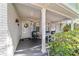 Inviting front porch with comfortable seating and a charming, decorated entry door at 9015 Sw 94Th St # D, Ocala, FL 34481