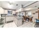 Bright kitchen with modern appliances and an open layout to the dining and living areas at 9015 Sw 94Th St # D, Ocala, FL 34481
