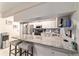 Well-equipped kitchen featuring a breakfast bar, modern appliances, and plenty of counter space at 9015 Sw 94Th St # D, Ocala, FL 34481