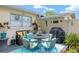 Cozy outdoor patio featuring comfortable seating and a grill, ideal for entertaining or relaxation at 9015 Sw 94Th St # D, Ocala, FL 34481