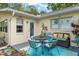 Inviting patio with seating, a grill, and access to a well-maintained backyard, perfect for outdoor gatherings at 9015 Sw 94Th St # D, Ocala, FL 34481
