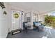 Inviting front porch features comfortable seating, creating a cozy and welcoming outdoor space at 9015 Sw 94Th St # D, Ocala, FL 34481