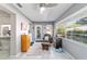 Sunroom offers a relaxing space with tiled floors, a ceiling fan, and large windows overlooking the backyard at 9015 Sw 94Th St # D, Ocala, FL 34481