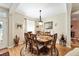 Dining room with an oval table and chairs set on a circular rug at 9290 Se 120Th Loop, Summerfield, FL 34491