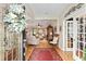 Open foyer with hardwood floors, showcasing the living room and office space at 9290 Se 120Th Loop, Summerfield, FL 34491