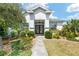 Inviting home with a beautifully landscaped front yard and a stylish entryway at 9290 Se 120Th Loop, Summerfield, FL 34491