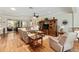 Spacious living room with hardwood floors, comfortable seating, and natural light at 9290 Se 120Th Loop, Summerfield, FL 34491