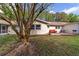Spacious backyard featuring a brick patio with comfortable outdoor seating and mature landscaping at 9331 Sw 84Th Ter # C, Ocala, FL 34481