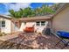 Backyard patio with brick pavers, seating, and a grill, great for outdoor enjoyment at 9331 Sw 84Th Ter # C, Ocala, FL 34481