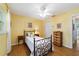Bright bedroom with a ceiling fan, wood-look floors, and a window for natural light at 9331 Sw 84Th Ter # C, Ocala, FL 34481