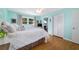 Bedroom featuring a comfortable bed, ceiling fan, ample natural light, and hardwood floors at 9331 Sw 84Th Ter # C, Ocala, FL 34481