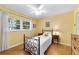 Bright bedroom with a ceiling fan, wood-look floors, and a window for natural light at 9331 Sw 84Th Ter # C, Ocala, FL 34481
