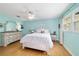 Bedroom featuring a comfortable bed, ceiling fan, ample natural light, and hardwood floors at 9331 Sw 84Th Ter # C, Ocala, FL 34481