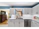 Modern kitchen features white cabinets, marble countertops and stainless steel appliances at 9331 Sw 84Th Ter # C, Ocala, FL 34481