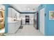 Modern kitchen with stainless steel appliances, white cabinets, and ample counter space at 9331 Sw 84Th Ter # C, Ocala, FL 34481