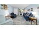 Inviting living room featuring hardwood floors, an area rug, and blue walls at 9331 Sw 84Th Ter # C, Ocala, FL 34481