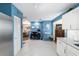 Open-concept living space seamlessly connects kitchen, dining area, and home office at 9331 Sw 84Th Ter # C, Ocala, FL 34481