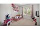 bedroom featuring decor, a single bed, and a window providing natural light at 9579 Sw 195 Cir, Dunnellon, FL 34432