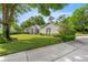 Well-maintained one-story home with green lawn, mature trees, and tasteful landscaping at 9579 Sw 195 Cir, Dunnellon, FL 34432