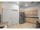 Bright kitchen offers stainless steel appliances, light wood cabinets and tile flooring at 9579 Sw 195 Cir, Dunnellon, FL 34432