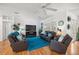 Inviting living room featuring a modern fireplace, plush seating, and stylish decor at 9579 Sw 195 Cir, Dunnellon, FL 34432