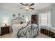 Bedroom with blue walls, and decorative wall art at 9957 Sw 55Th Avenue Rd, Ocala, FL 34476