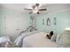 Bedroom featuring neutral colors, ceiling fan and double door closet at 9957 Sw 55Th Avenue Rd, Ocala, FL 34476