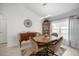 Dining area with modern light fixture, decor, and natural light creating an inviting atmosphere at 9957 Sw 55Th Avenue Rd, Ocala, FL 34476