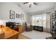 Bright home office with desk, chair, and window offering ample natural light at 9957 Sw 55Th Avenue Rd, Ocala, FL 34476