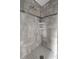 Modern tiled shower with built-in shelves and a sleek design at 9957 Sw 55Th Avenue Rd, Ocala, FL 34476