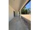 Covered patio offering a serene outdoor space with a view of the surrounding natural landscape at 11537 Sw 59Th Ter, Ocala, FL 34476