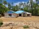 New construction home featuring block construction, a covered entry, and large lot at 13131 Sw 52Nd Lane Rd, Ocala, FL 34481