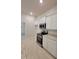 Modern kitchen featuring white cabinets, stainless steel appliances, and granite countertops at 13131 Sw 52Nd Lane Rd, Ocala, FL 34481