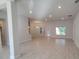 Spacious, open-concept living room with neutral colors and tile flooring throughout at 13131 Sw 52Nd Lane Rd, Ocala, FL 34481