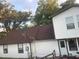 View of the side of the home with a brown roof, a new addition, and AC units at 14953 Se 107Th Ave, Summerfield, FL 34491