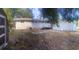 Backyard featuring a shed, deck, and screened in porch at 1858 Se Lake Weir Ave, Ocala, FL 34471