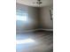 Cozy bedroom with modern flooring and ample natural light at 1858 Se Lake Weir Ave, Ocala, FL 34471