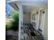 Inviting covered front porch with decorative flooring and seating at 1858 Se Lake Weir Ave, Ocala, FL 34471